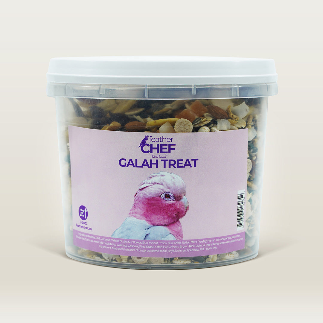 Container of Feather Chef Galah Treats on a beige background.