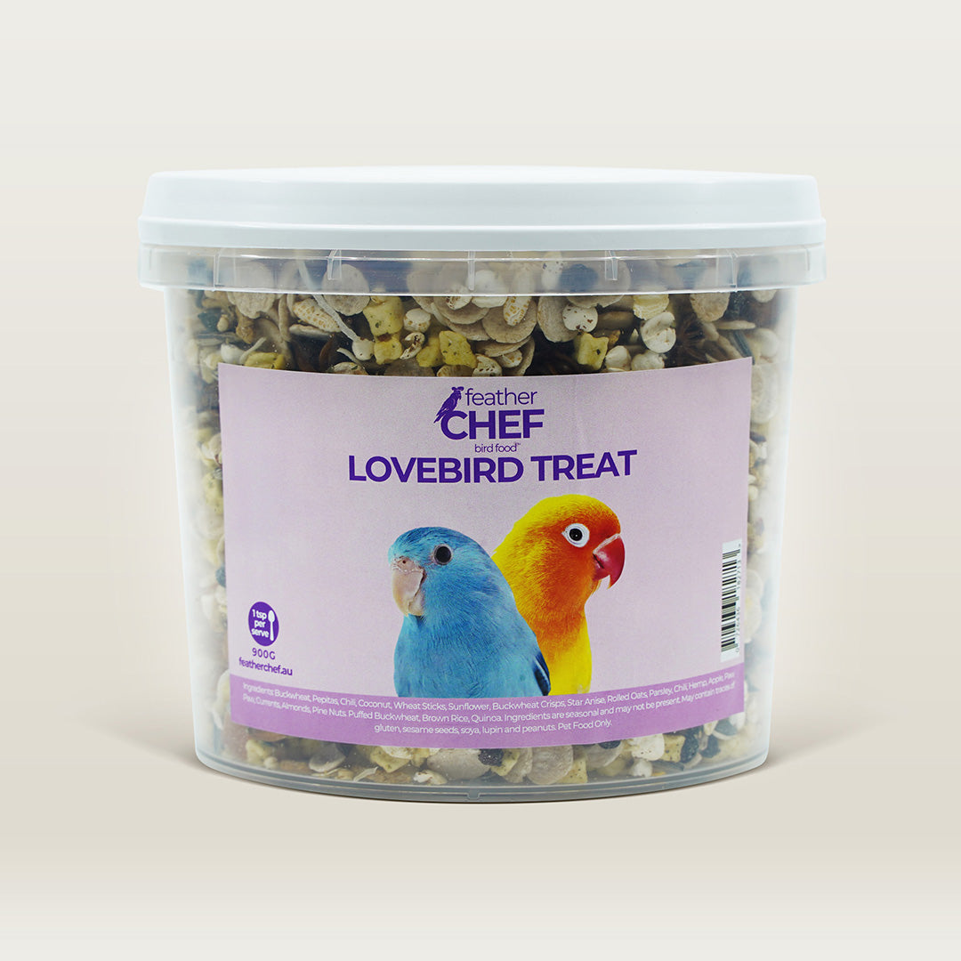 Container of Feather Chef Lovebird Treats with Lovebirds on a label against a beige background
