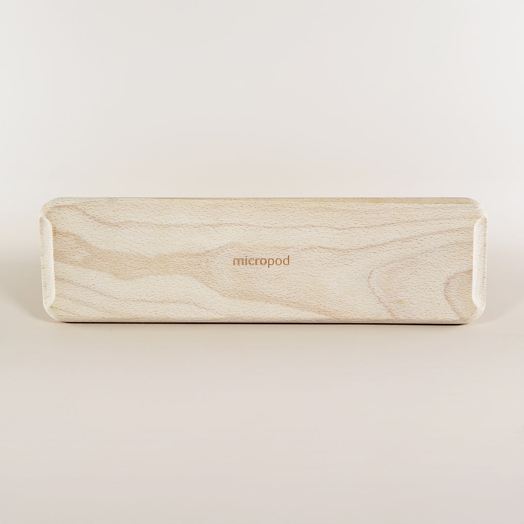 Flat lay of the Micropod Continuous Grow Kit wooden base, designed to hold trays for staggered microgreens harvests with Seed Cube feeding.