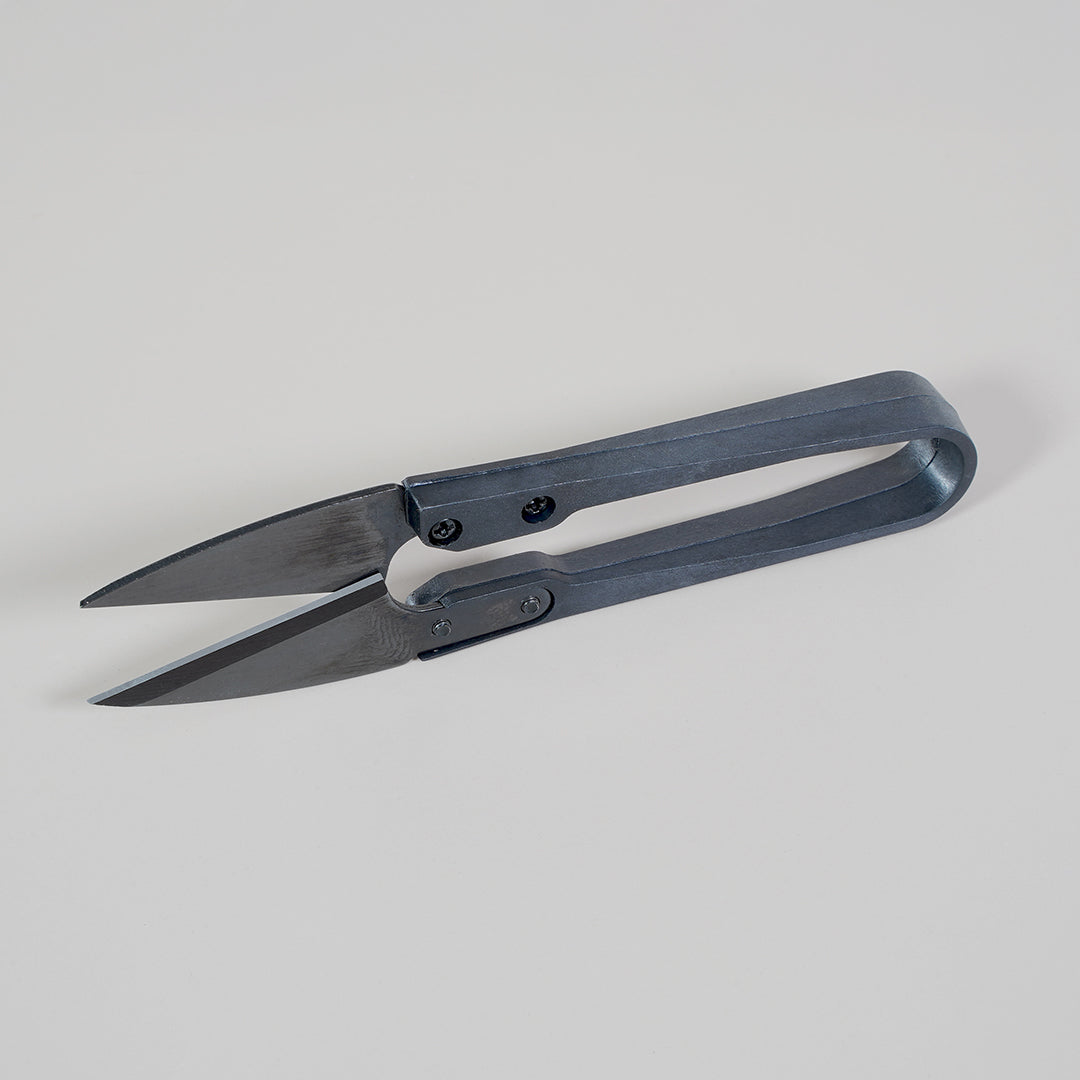 Side view of Micropod Micro Snips, lightweight scissors made for cleanly cutting microgreens to serve with Seed Cube feeding routines.