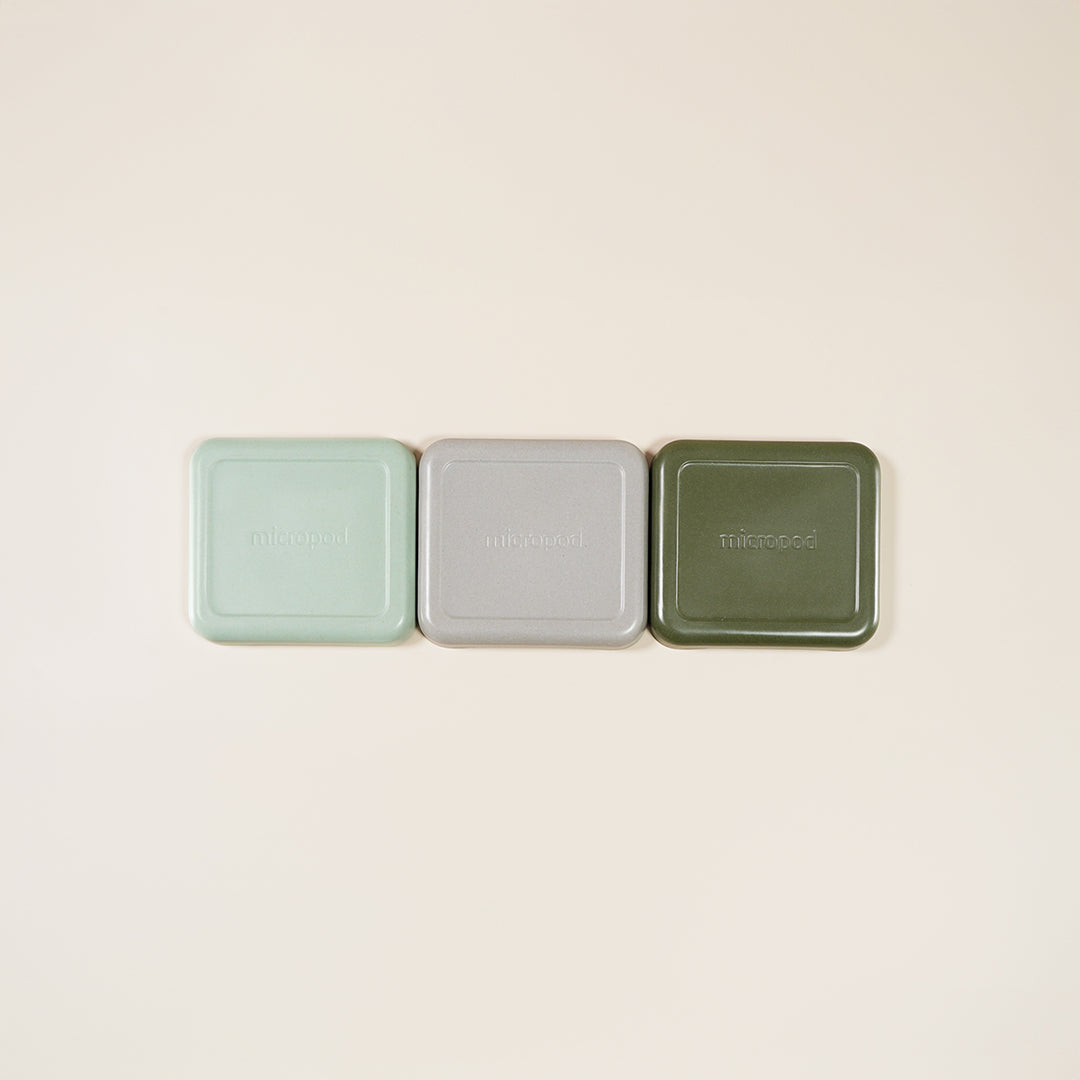 Lineup of three Micropod small lids in different colours, showing stylish options for covering trays during germination and pairing with Seed Cube microgreens feeding.