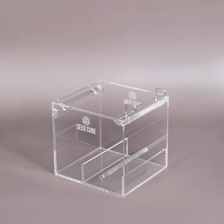 Front view of the Small Seed Cube installed in cage